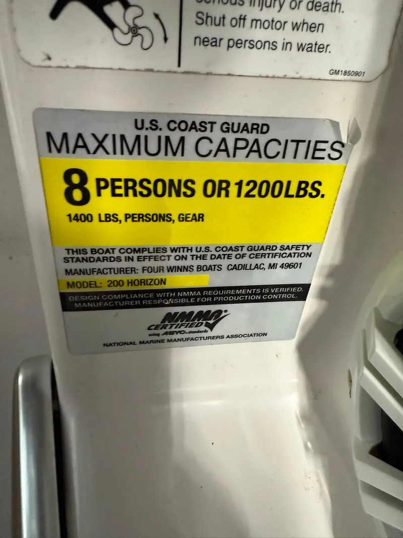 Slide: The Image of 2009 Four Winns H200 capacity label, 8 persons or 1200 lbs, U.S. Coast Guard compliant. - 13