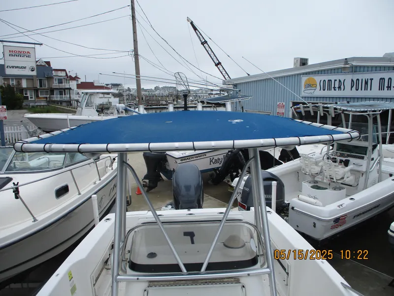Slide: The Image of 1995 Wellcraft 218ccf boat with blue canopy at Somers Point Marina. - 13