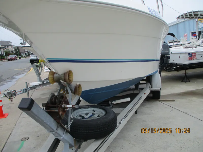 Slide: The Image of 1995 Wellcraft 218ccf boat on trailer, parked outdoors. - 19