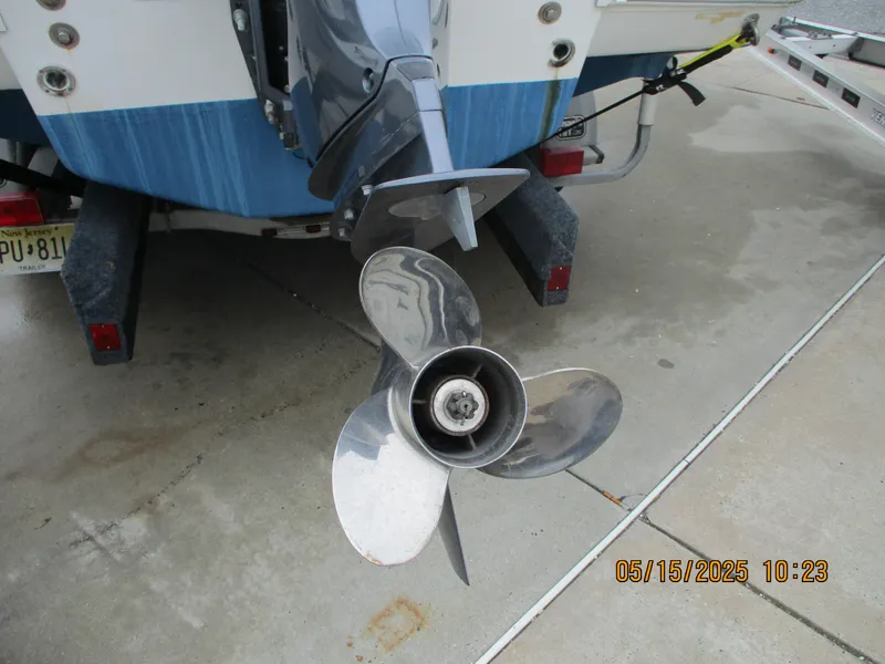Slide: The Image of 1995 Wellcraft 218ccf boat propeller and motor on trailer. - 22