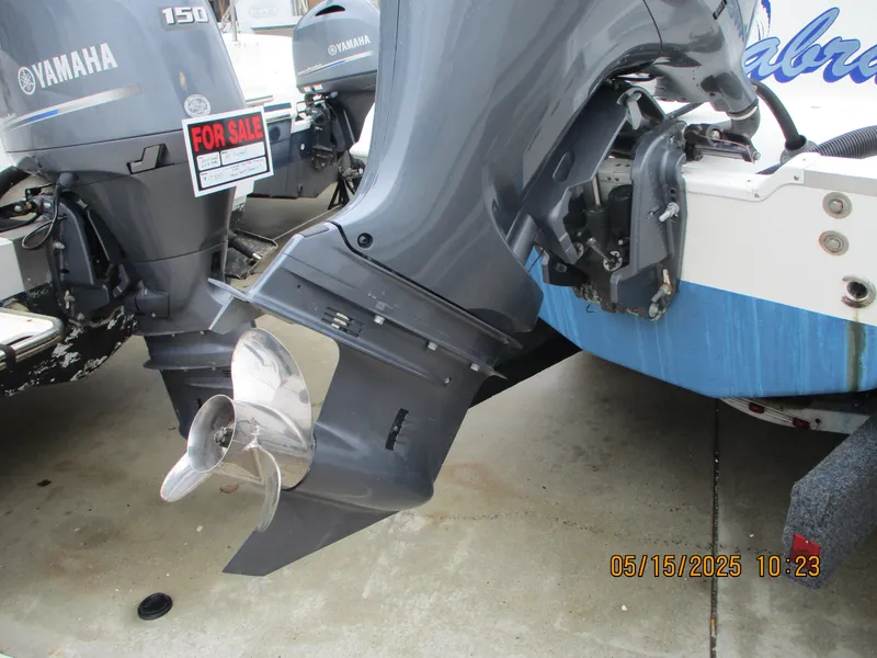 Slide: The Image of 1995 Wellcraft 218ccf boat with Yamaha outboard motors, for sale sign visible. - 23