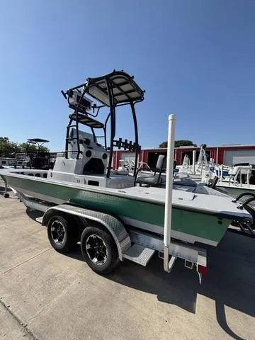 Slide: The Image of 2024 Majek 24 Reaper boat on trailer, featuring a sleek design and sturdy build. - 4