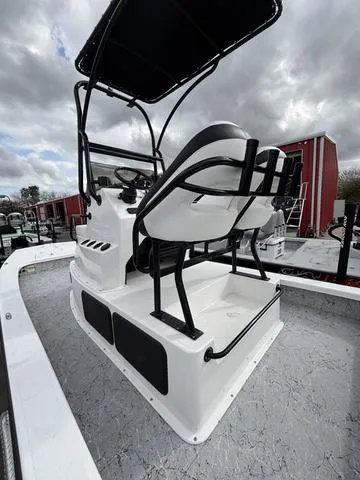 Slide: The Image of 2024 Majek 25 ILLUSION boat with elevated helm and seating, under cloudy skies. - 6