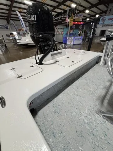 Slide: The Image of 2024 Majek 2206 Illusion boat with Suzuki engine displayed indoors. - 5