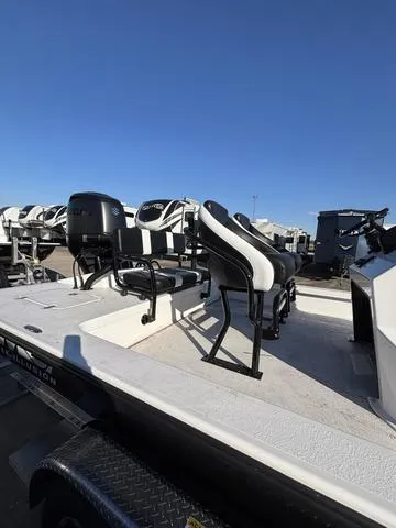 Slide: The Image of 2025 Majek M2 ILLUSION boat with sleek seating, showcased under a clear blue sky. - 3