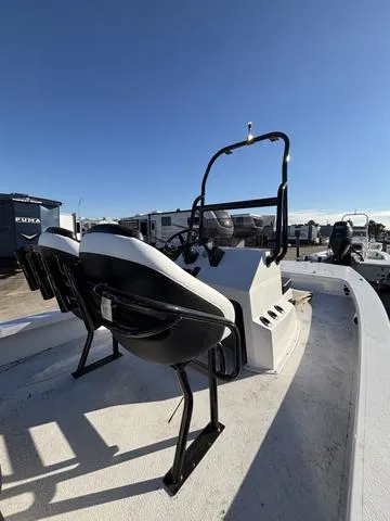 Slide: The Image of 2025 Majek M2 ILLUSION boat with dual seats and console, under clear blue sky. - 4