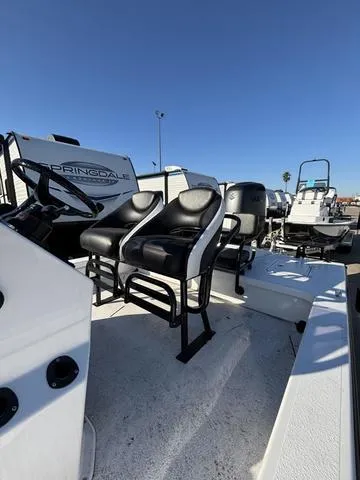 Slide: The Image of 2025 Majek M2 ILLUSION boat with dual black seats and steering console. - 6