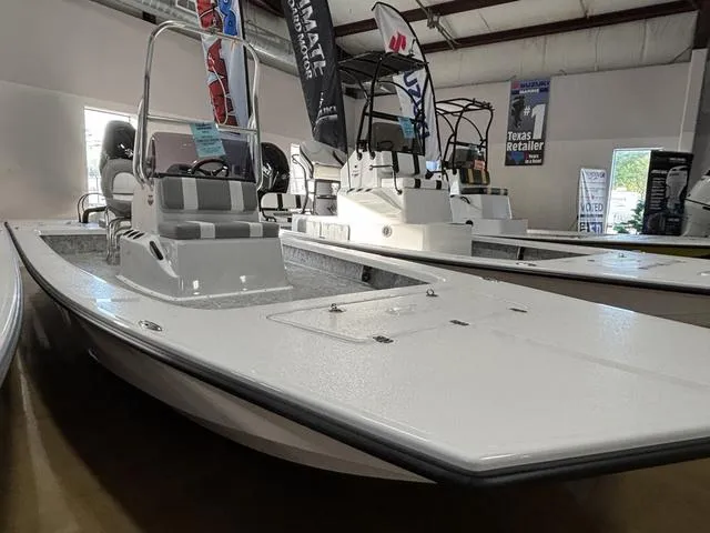 Slide: The Image of 2025 Majek 2206 Illusion boat displayed in showroom, featuring sleek design and modern features. - 1