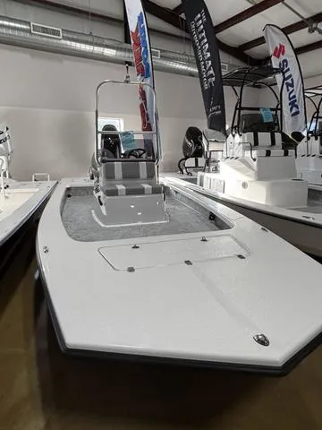 Slide: The Image of 2025 Majek 2206 Illusion boat displayed in showroom with Suzuki banners. - 3