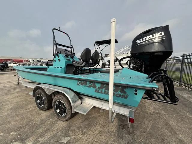 Slide: The Image of 2025 Majek 2206 Illusion boat with Suzuki engine on a trailer. - 2