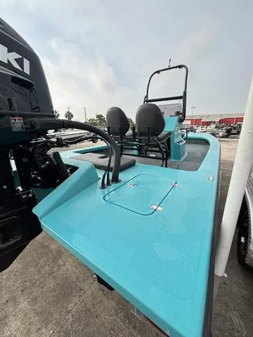 Slide: The Image of 2025 Majek 2206 Illusion boat with Suzuki engine, turquoise deck, and dual seating. - 3