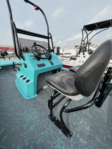 Slide: The Image of 2025 Majek 2206 Illusion boat interior with steering console and seating. - 5