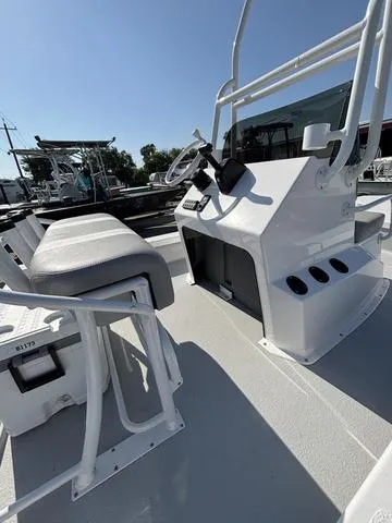 Slide: The Image of 2025 Majek 18 M2 boat interior with steering console and seating. - 5