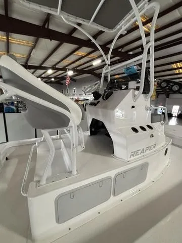 Slide: The Image of 2025 Majek 24 Reaper boat interior in a showroom, showcasing sleek design and modern features. - 6