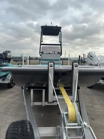 Slide: The Image of 2025 Majek 21 RFL boat on trailer, cloudy sky background. - 3