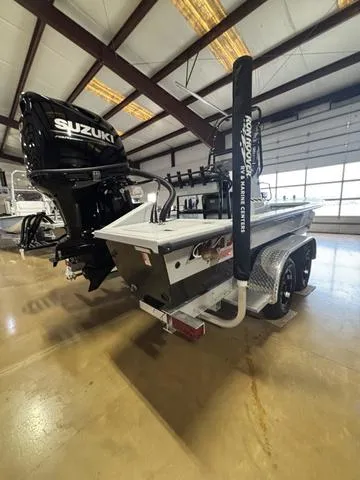 Slide: The Image of 2025 Majek 21 RFL boat with Suzuki engine in showroom. - 3