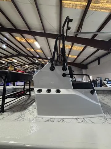 Slide: The Image of 2025 Majek 21 RFL boat console in a showroom with overhead lighting. - 5