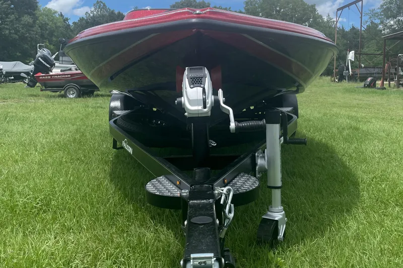 Slide: The Image of 2025 Falcon Boats F215 on trailer, parked on grass, front view. - 1