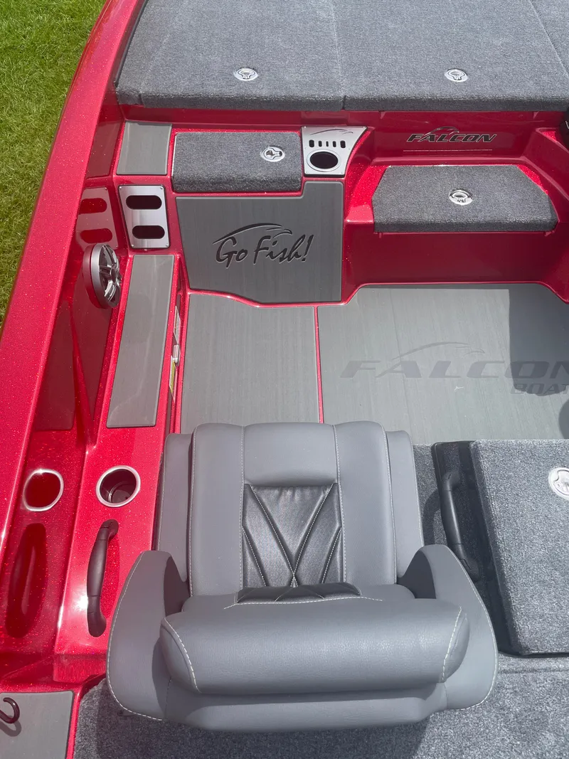 Slide: The Image of 2025 Falcon Boats F215 interior with red and gray design, featuring "Go Fish!" branding. - 4