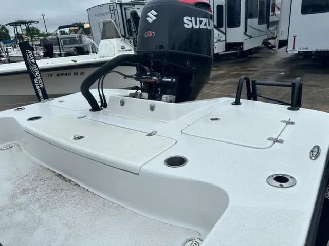 Slide: The Image of 2023 Catalyst Boat Works 2200 CAT with Suzuki outboard motor, displayed outdoors. - 12