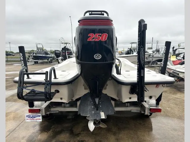 Slide: The Image of 2023 Catalyst Boat Works 2200 CAT with powerful 250 engine, rear view on trailer. - 4