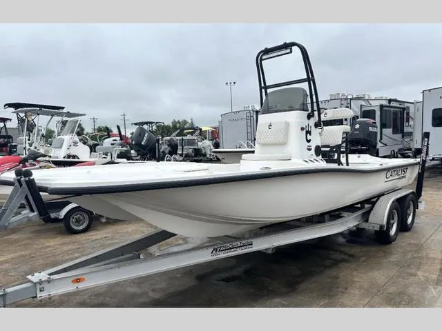 Slide: The Image of 2023 Catalyst Boat Works 2200 CAT on trailer, displayed outdoors. - 5