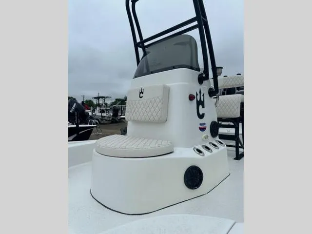 Slide: The Image of 2023 Catalyst Boat Works 2200 CAT, white console with seating and steering wheel. - 8