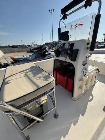 Slide: The Image of 2024 Carolina Skiff E18 JVX CC boat interior with console and seating. - 6