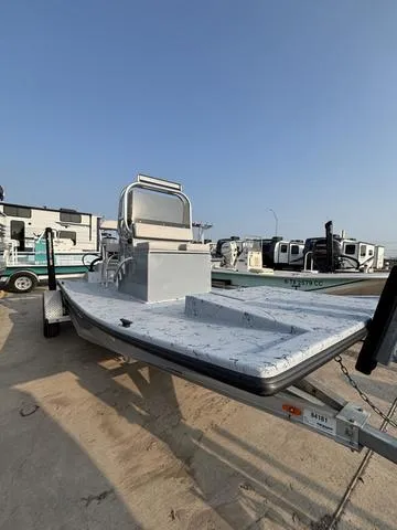 Slide: The Image of 2024 Cougar Marine Payton Scooter boat on trailer, parked outdoors. - 4