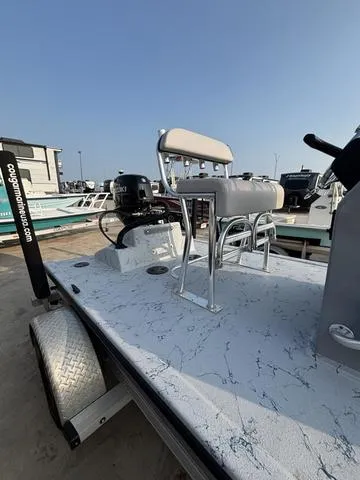 Slide: The Image of 2024 Cougar Marine Payton Scooter boat on trailer, featuring sleek design and modern seating. - 5