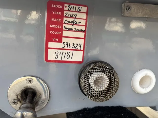 Slide: The Image of 2024 Cougar Marine Payton Scooter label with stock and VIN details. - 7