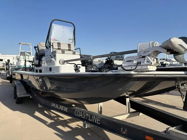 Slide: The Image of 2022 Majek 25 ILLUSION boat on trailer, featuring sleek design and modern equipment. - 2