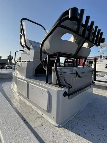 Slide: The Image of 2022 Majek 25 ILLUSION boat with seating and rod holders, viewed from the rear. - 5
