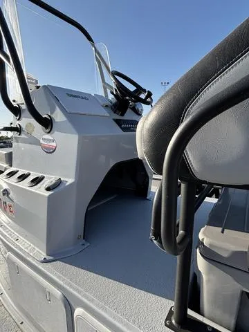 Slide: The Image of 2022 Majek 25 ILLUSION boat interior with steering console and seating. - 6