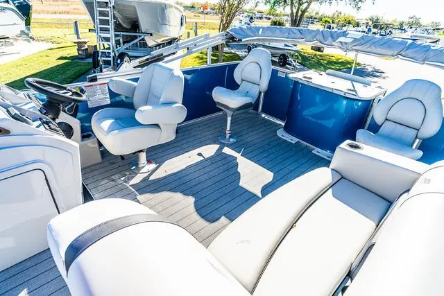 Slide: The Image of 2025 Starcraft EX20FD pontoon boat interior with plush seating and modern design. - 10