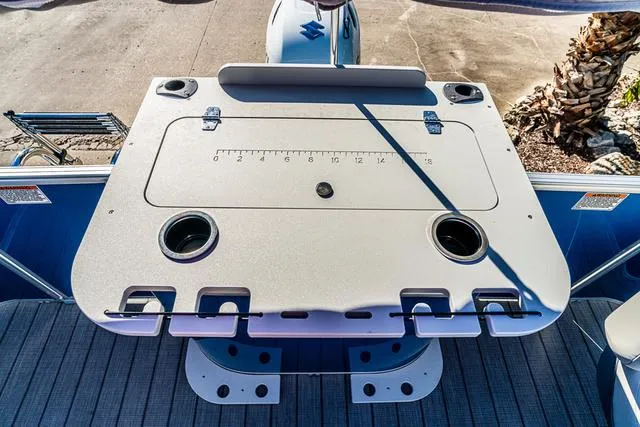 Slide: The Image of 2025 Starcraft EX20FD boat deck with fishing station and built-in rod holders. - 12