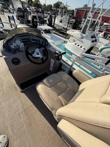 Slide: The Image of 2021 Sun Tracker FISH BARGE 20 boat interior with steering console and seating. - 7
