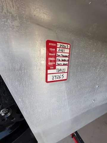 Slide: The Image of 2021 Sun Tracker FISH BARGE 20 label with stock and VIN details. - 8