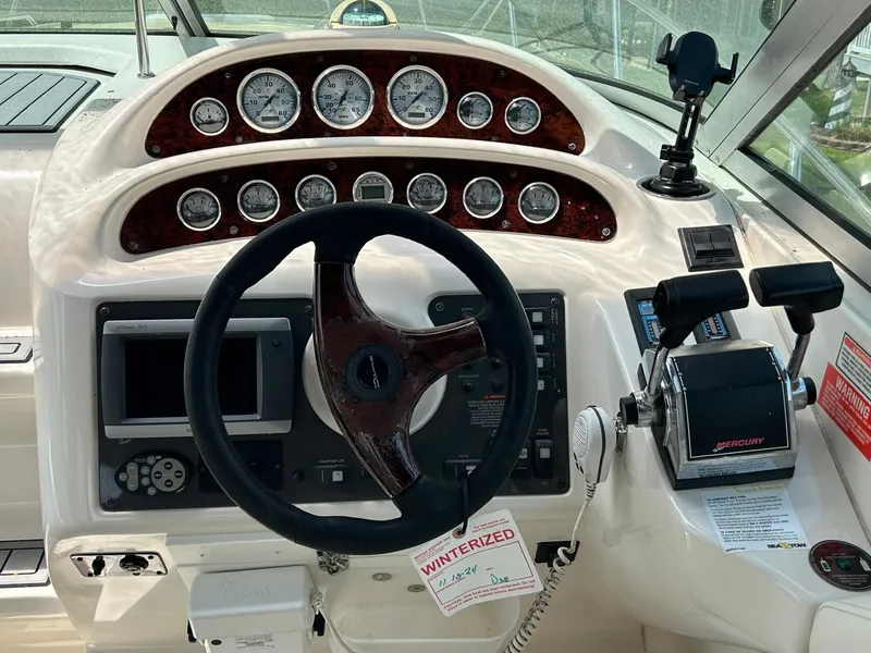 Slide: The Image of 2003 Monterey 302 Cruiser dashboard with steering wheel and control panel. - 10