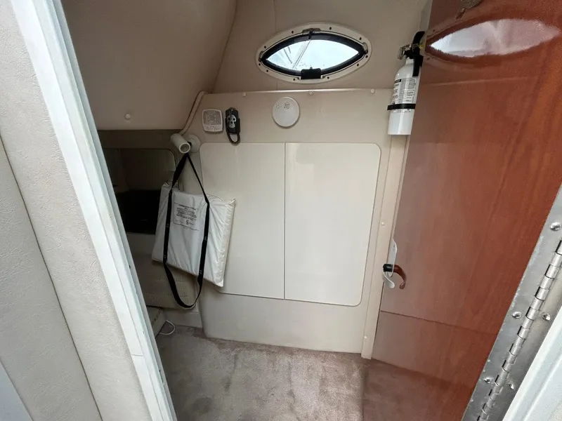 Slide: The Image of Interior cabin of a 2003 Monterey 302 Cruiser with porthole and fire extinguisher. - 22
