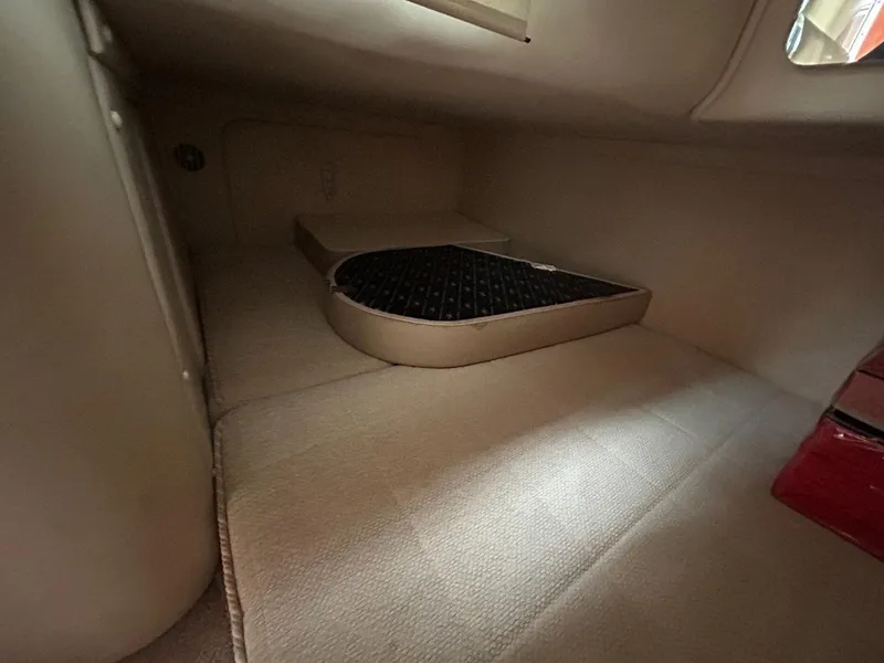 Slide: The Image of Interior cabin of a 2003 Monterey 302 Cruiser, featuring beige upholstery. - 24
