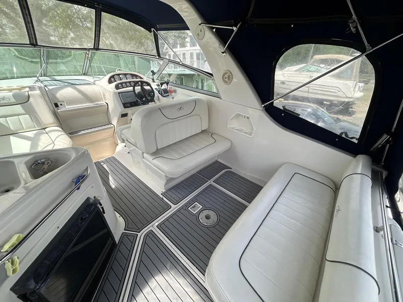 Slide: The Image of 2003 Monterey 302 Cruiser interior with white seating and modern dashboard. - 5