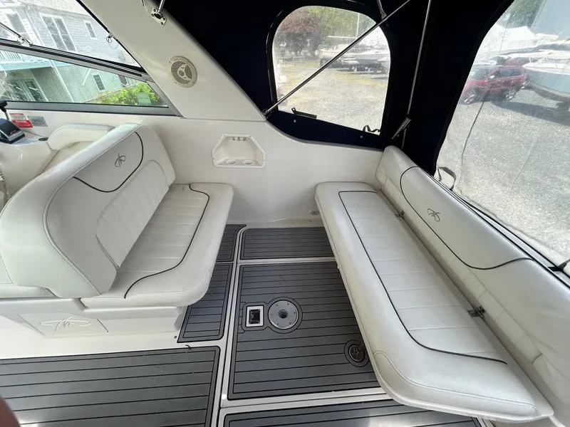 Slide: The Image of 2003 Monterey 302 Cruiser interior with white seating and sleek flooring. - 6
