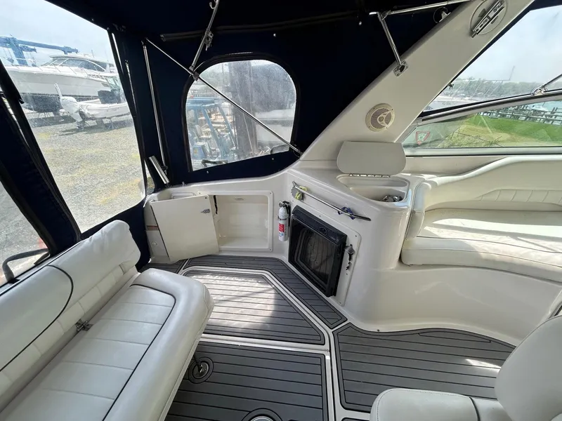 Slide: The Image of 2003 Monterey 302 Cruiser interior with white seating and modern amenities. - 7