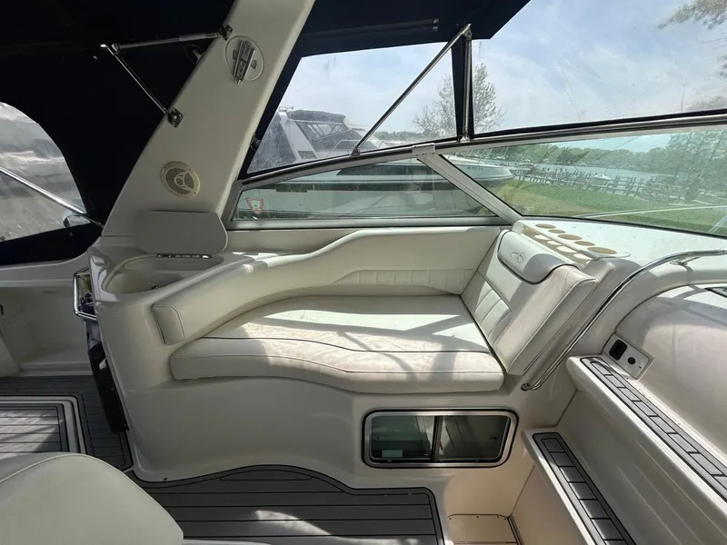 Slide: The Image of 2003 Monterey 302 Cruiser interior with white seating and large windows. - 8