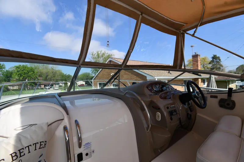 Slide: The Image of Interior view of 2000 Maxum 2700 SCR boat cockpit with steering wheel and dashboard. - 10