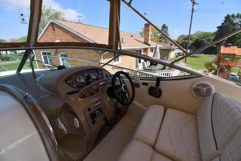 Slide: The Image of Interior view of 2000 Maxum 2700 SCR boat cockpit with steering wheel and dashboard. - 11