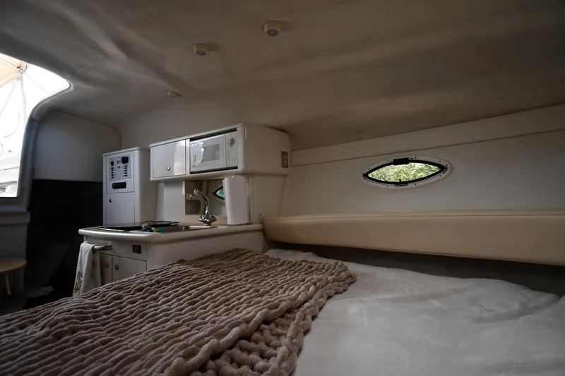 Slide: The Image of Interior of 2000 Maxum 2700 SCR boat with cozy bed and kitchenette. - 32