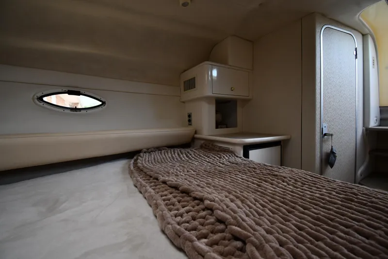 Slide: The Image of Cozy interior cabin of 2000 Maxum 2700 SCR boat with plush bedding. - 33