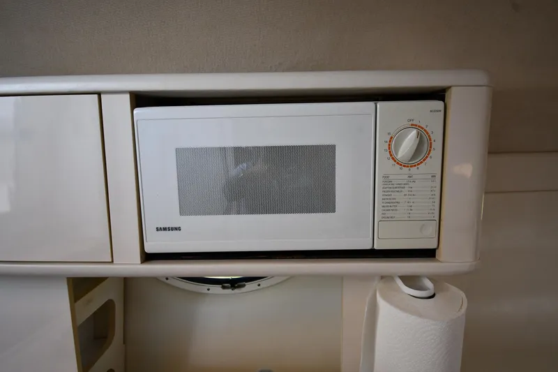 Slide: The Image of Microwave in 2000 Maxum 2700 SCR boat kitchen, with paper towel holder. - 36